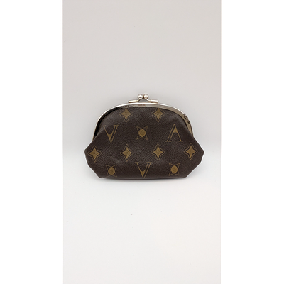 Coin Purse - Kiss Lock Closure. Description: Brown fabric coin purse with kiss lock closure. 
