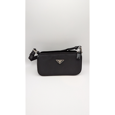Prada Handbag - Black, Nylon, Compact Design. Description: Prada black nylon handbag with 