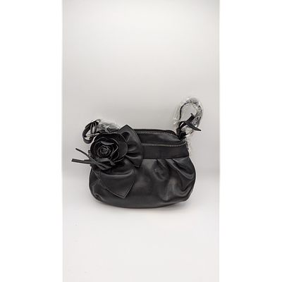 Black Handbag with Rose Detail. Description: Black faux leather handbag with rose detail. Zipper 