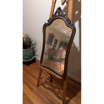 Antique Carved Wood Ornate Mirror. Description: An antique mirror with an ornate frame. Made of 