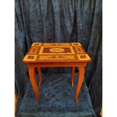 Accent Table Reddish-brown Wood Inlay. Vintage wooden accent table with intricate marquetry 