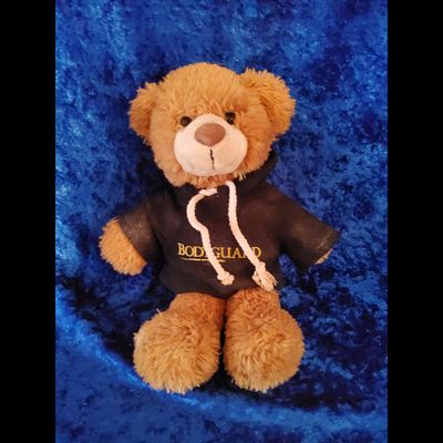 Brown Plush Bodyguard Bear Likely New Condition Est. $10-15. Description: Brown plush bear with 