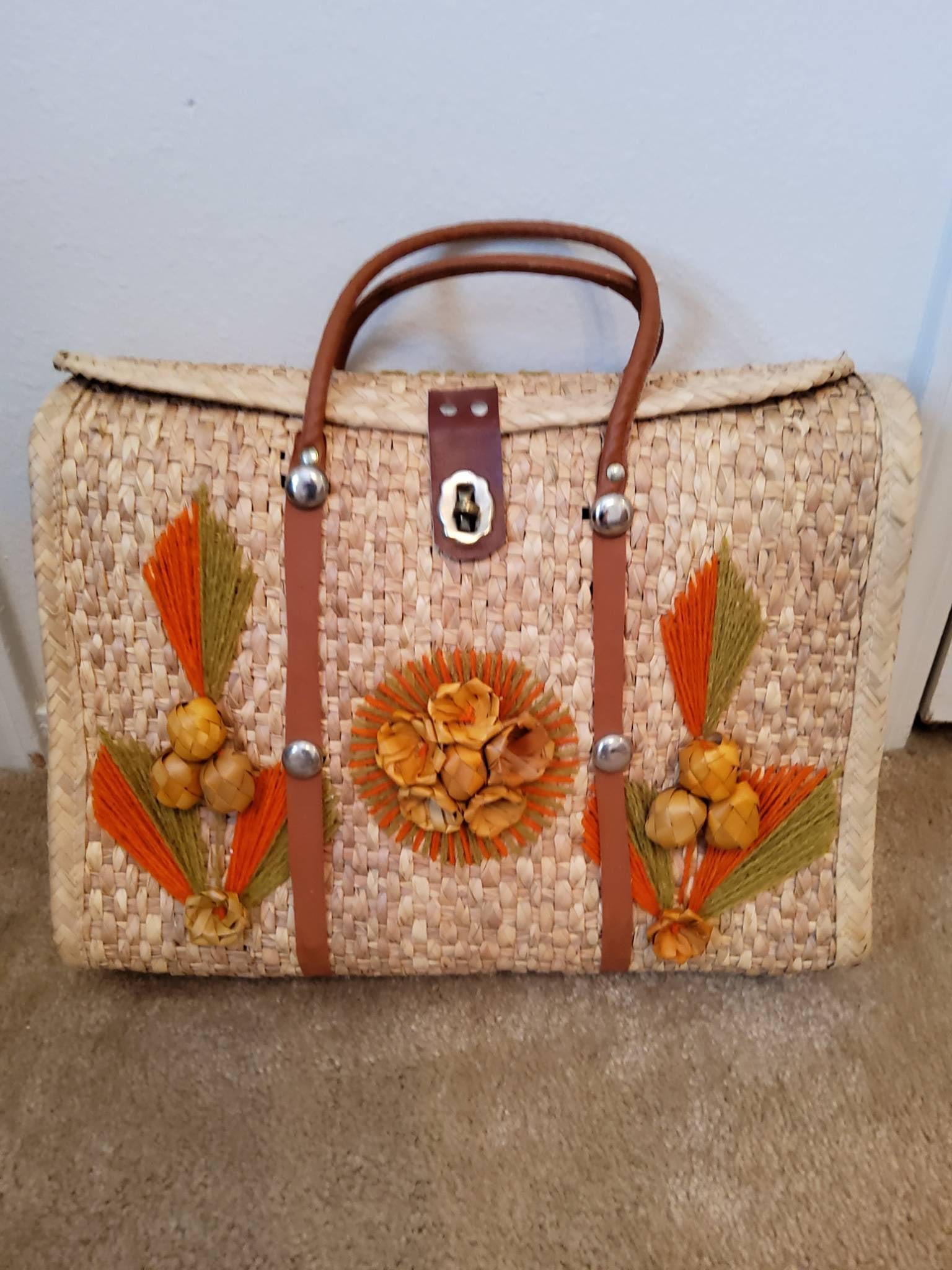 Woven Straw Bag with Leather Handles and Floral Accents