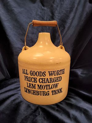 Vintage Jack Daniels Lem Motlow Whiskey Jug. "All Goods Worth Price Charged" was a marketing 