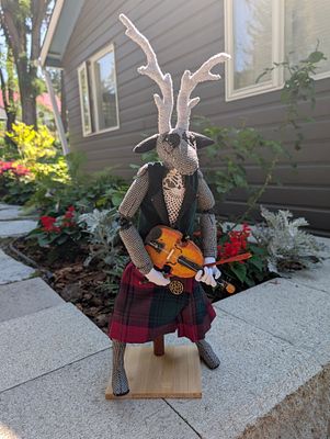 Cher - Cher. "Scottish Stag with Violin". Textile. 18"H. $325 FMV. Cheryl is a doll-maker and