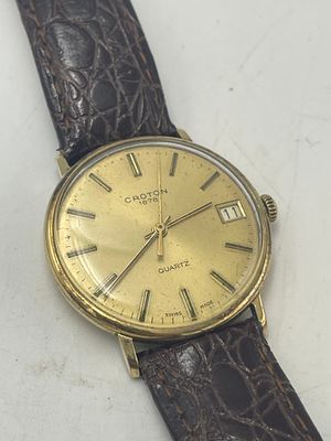 שעון יד גברי זה הוא מדגם Croton 187 זהב 14K בעל מנגנון קוורץ שווייצרי. מצב עבודה לא חדוע . שעון 