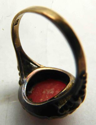 Ring with coral in a case. Ring with coral in case, hallmarked "333", ring head filigree 