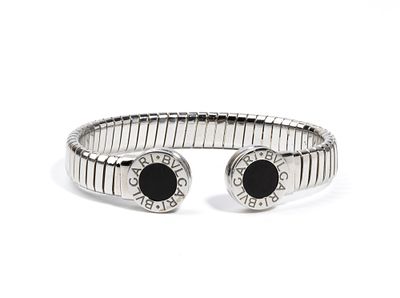 BULGARI - a steel tube, embellished with two circular onyx inlays. Signed: "BVLGARI". 
Hallmarked 