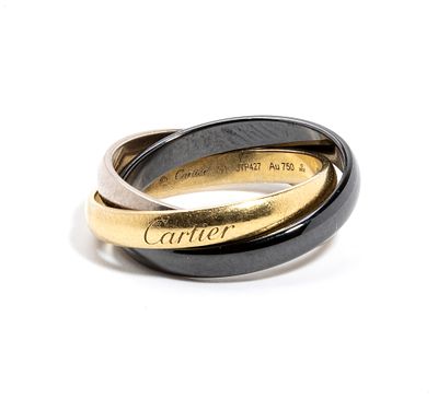 CARTIER - Three intertwined bands in 18-carat yellow gold, burnished gold and white gold. Signed 