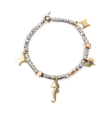 DODO - 12k rose gold, 750 yellow gold, 925/1000 silver. 
Hallmarked "750 - 1464 MI - 551 MI - 
