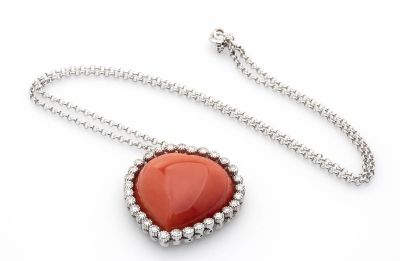 White gold necklace, pendant set with diamonds and heart shape carved Cerasuolo coral 