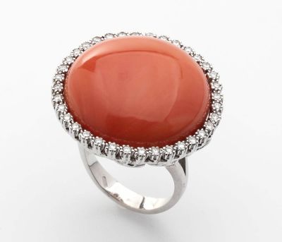 White gold, diamonds and carved Cerasuolo coral (Corallium Elatius) ring. Stamped "750", Italy 