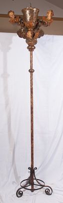 Candlestick on polychrome wooden rod, 18th century. 230 X 60 x 20 cm gold and silver. It is 
