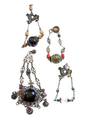 Four amulets made of silver, wood and glass paste, Sardegna. Total weight: 92 g. made of 800 