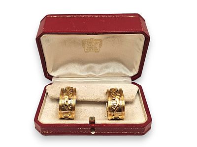 CARTIER - I8k yellow and white gold, each hoop earring features the legendary Panth&egrave;re de Cartier 