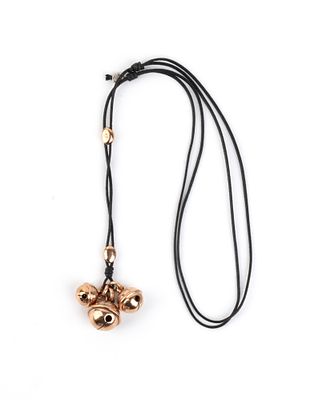 POMELLATO - three 9k rose gold rattles suspended from a braided fabric rope. 
They bear the 