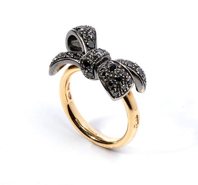 POMELLATO - yellow and white colour 18k gold, set with black diamond bow motif. Signed 