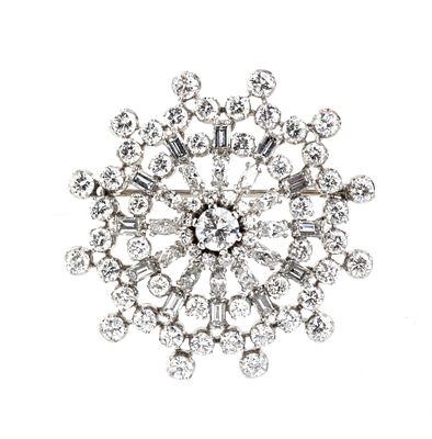 Platinum flower diamond brooch. Set with 36 round brilliant-cut diamonds, 12 rectangular 