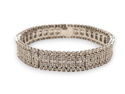 Diamond platinum bracelet. articulated ribbon motif, with pav&eacute;-set huit-huit cut diamonds 