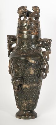 Green jadeite urn vase, China, Quing Dynasty, 19th century. 35 x 7.3 x 6.8 cm with a foo dog 