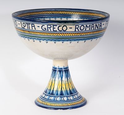 Polychrome ceramic advertising cup. 19 x 20.5 x 11.3 cm with a basin-shaped body and truncated 