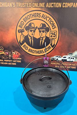 Lodge 12" footed Dutch oven with lid which also can be used as griddle
