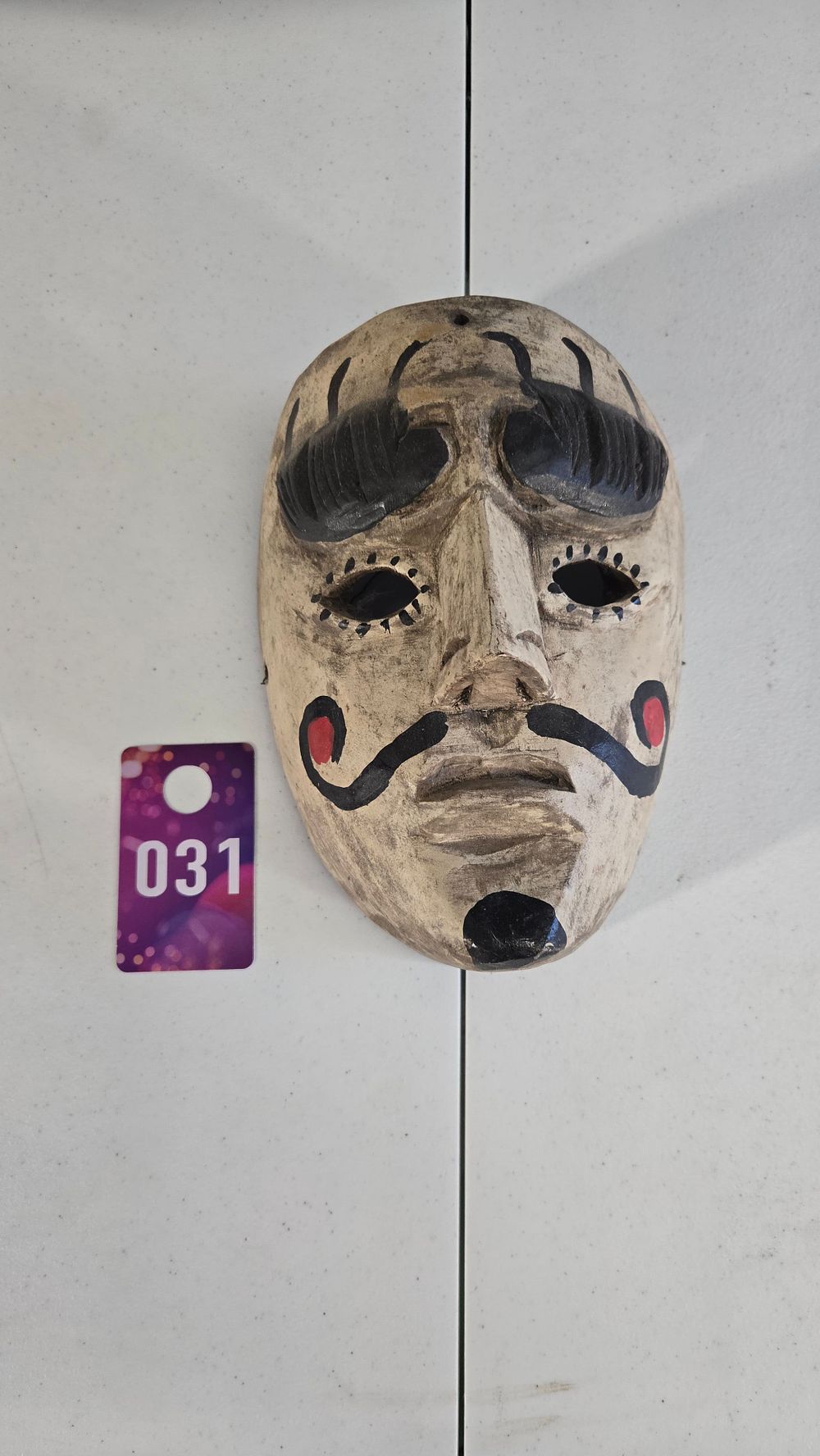 Lot 31: Hand Carved and painted wall hanging mask