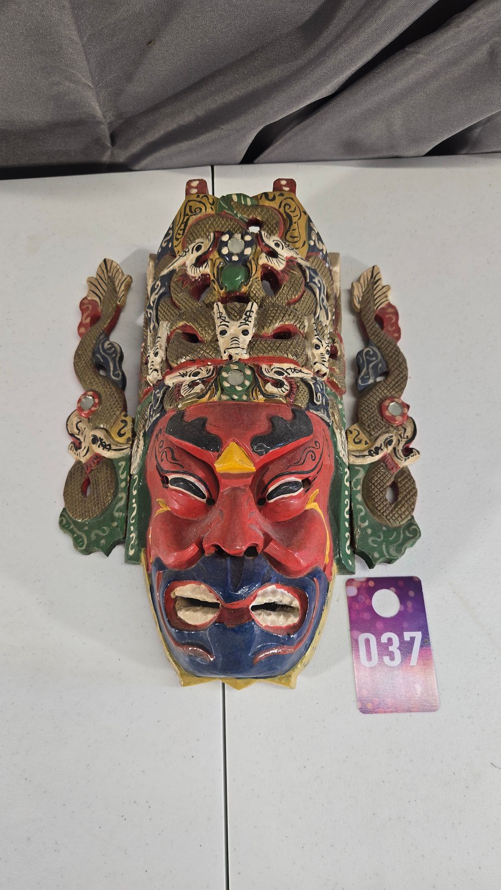 Lot 37: Hand Carved and painted wall hanging mask