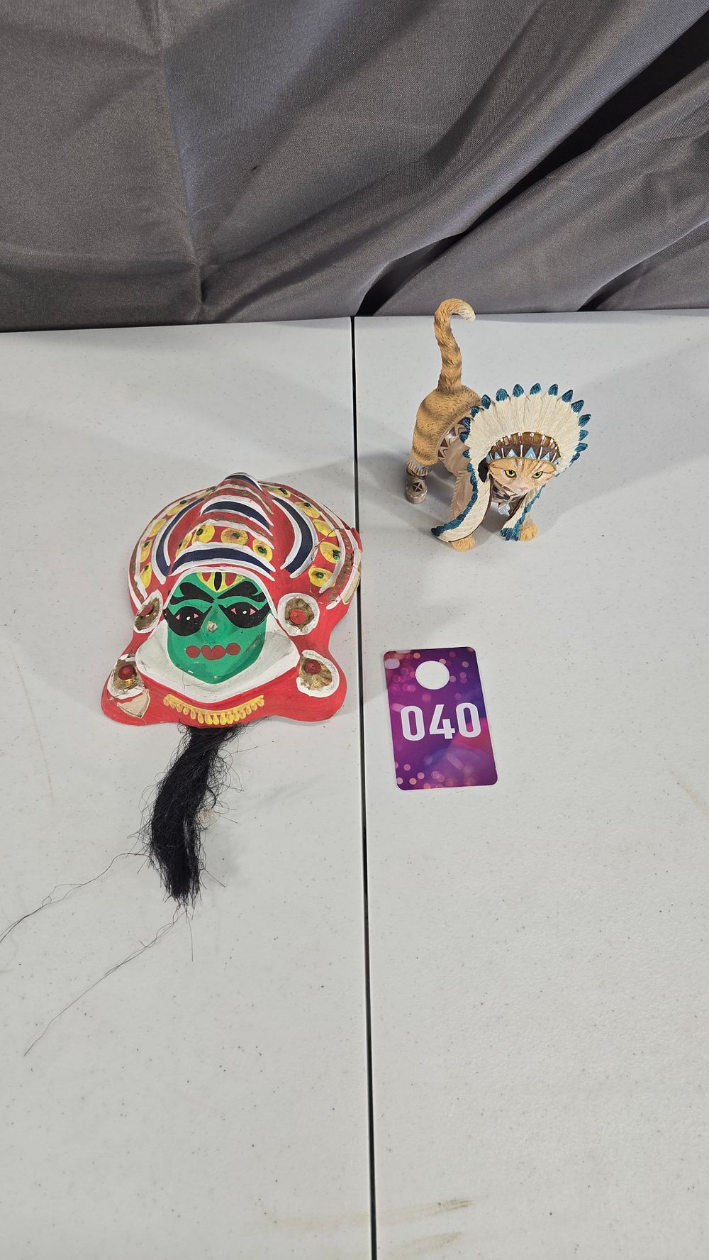 Lot 40: Hand Carved and painted wall hanging mask and cat with Indian Head Dress