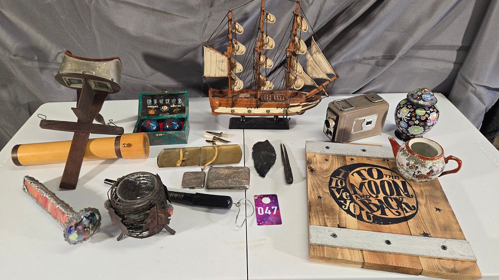 Lot 47: Model ship, ring sizer, Baoding Balls, slide viewer, kaleidoscope and more!
