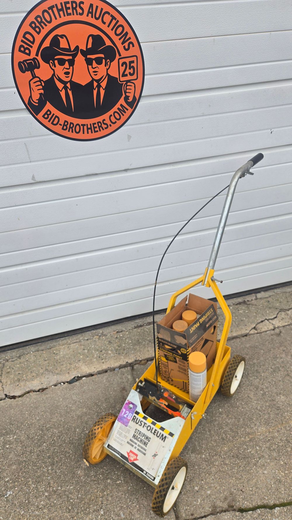 Lot 128: Rust-Oleum Striping Machine with 7 cans of yellow paint