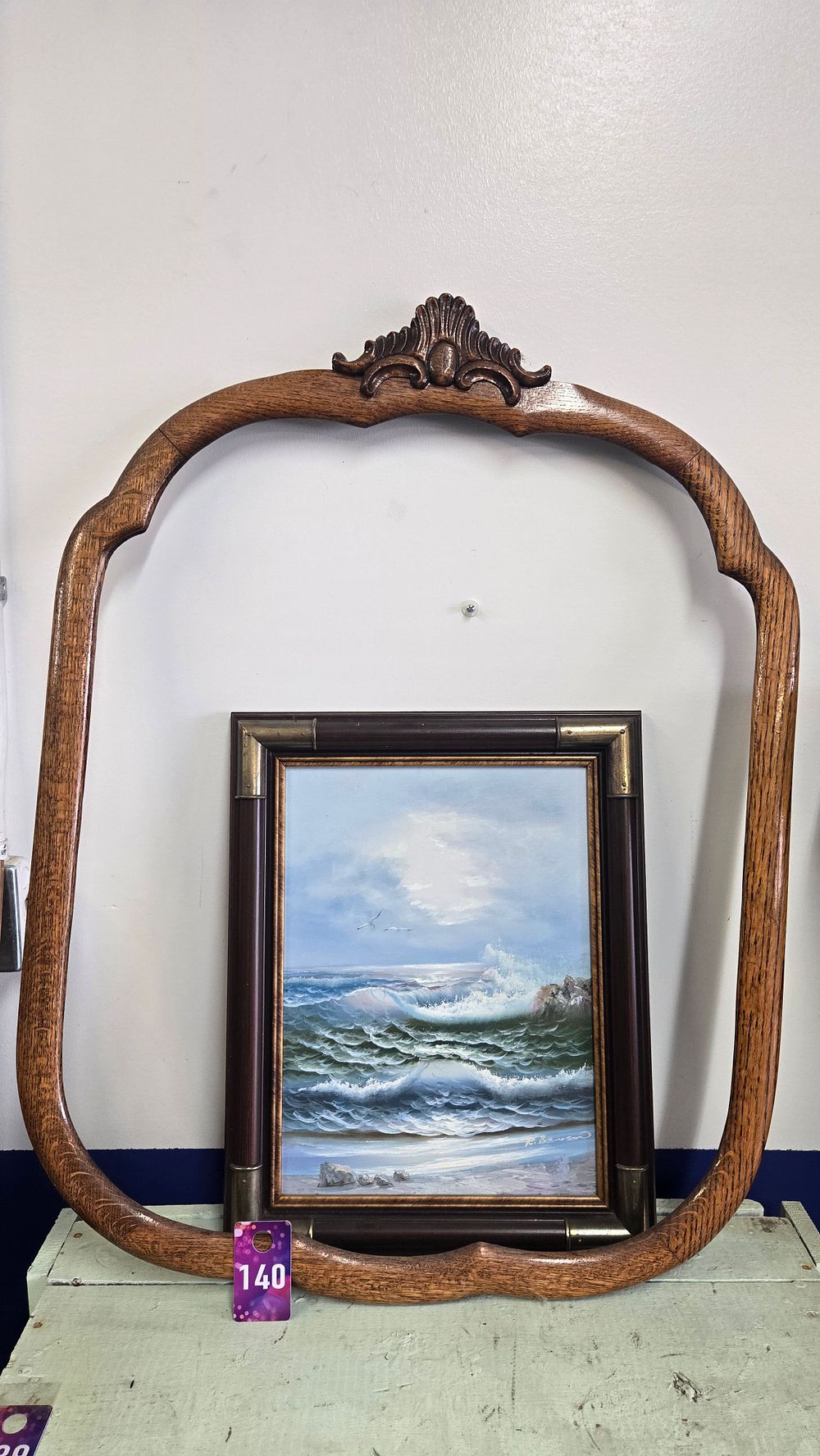Lot 140: Oak mirror frame and ocean painting