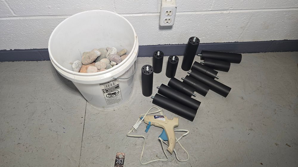 Lot 263: Bucket of rocks and glue gun