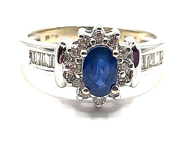Oval Blue Sapphire and Diamond Halo Ring. The Basics! 
Metal &amp; Color Weight Gemstone 