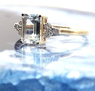 Genuine Aquamarine and Diamond Bridge Ring. 14K Yellow Gold 
Genuine Aquamarine 
Earth-Mined 