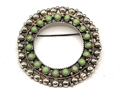 Vintage Sterling Silver Green Turquoise Brooch. Hand-wrought in Mexico, this vintage sterling 