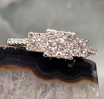 Princess Triple Halo Diamond Ring, Daisy Trilogy . Setting: 14K White Gold 
Main Gemstone: 