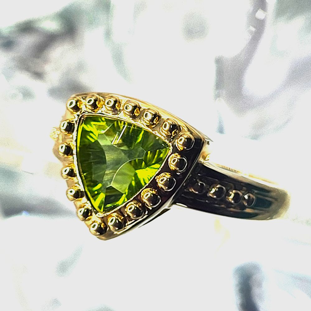 Fancy Trilliant-Cut Peridot Ring. Setting: 14K Yellow Gold 
Main Gemstone: Genuine Peridot 