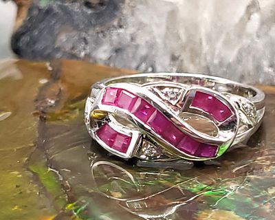 Square-cut Ruby and Round Diamond Infinity Ring. This lovely ring is especially suited for a
