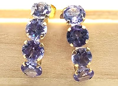 Twinkling Tanzanite Minimalist Half-Hoop Earrings. Setting: 14K Yellow Gold
Main