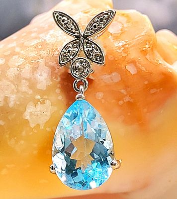 Swiss Blue Topaz & Diamond Butterfly Drop Pendant. Setting: Sterling Silver .925
Main