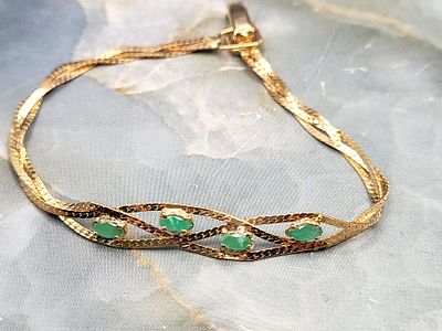 Vintage 14K Braided Herringbone & Emerald Bracelet. Setting: 14K Yellow Gold
Main