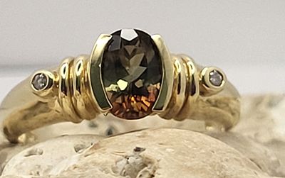 Andalusite & Diamond Ring – Color-Change Phenomena. Setting: 14K Yellow Gold 
Main Gemstone: 