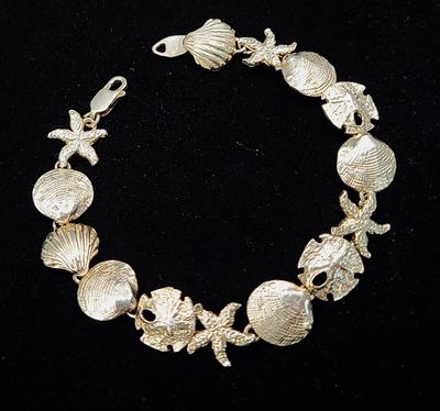 Seashells, Sand Dollars, Starfish, and Scallops Bracelet. Cast in: Sterling Silver .925 
