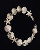 Seashells, Sand Dollars, Starfish, and Scallops Bracelet. Cast in: Sterling Silver .925 
Image - 4