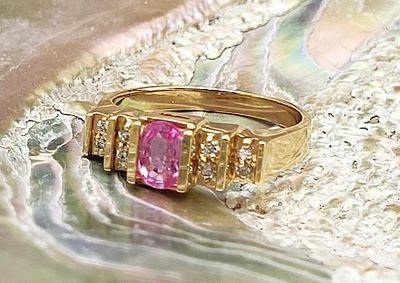 Fancy Pink Sapphire and Natural Diamond Ring. Setting: 14K Yellow Gold 
Main Gemstone: 