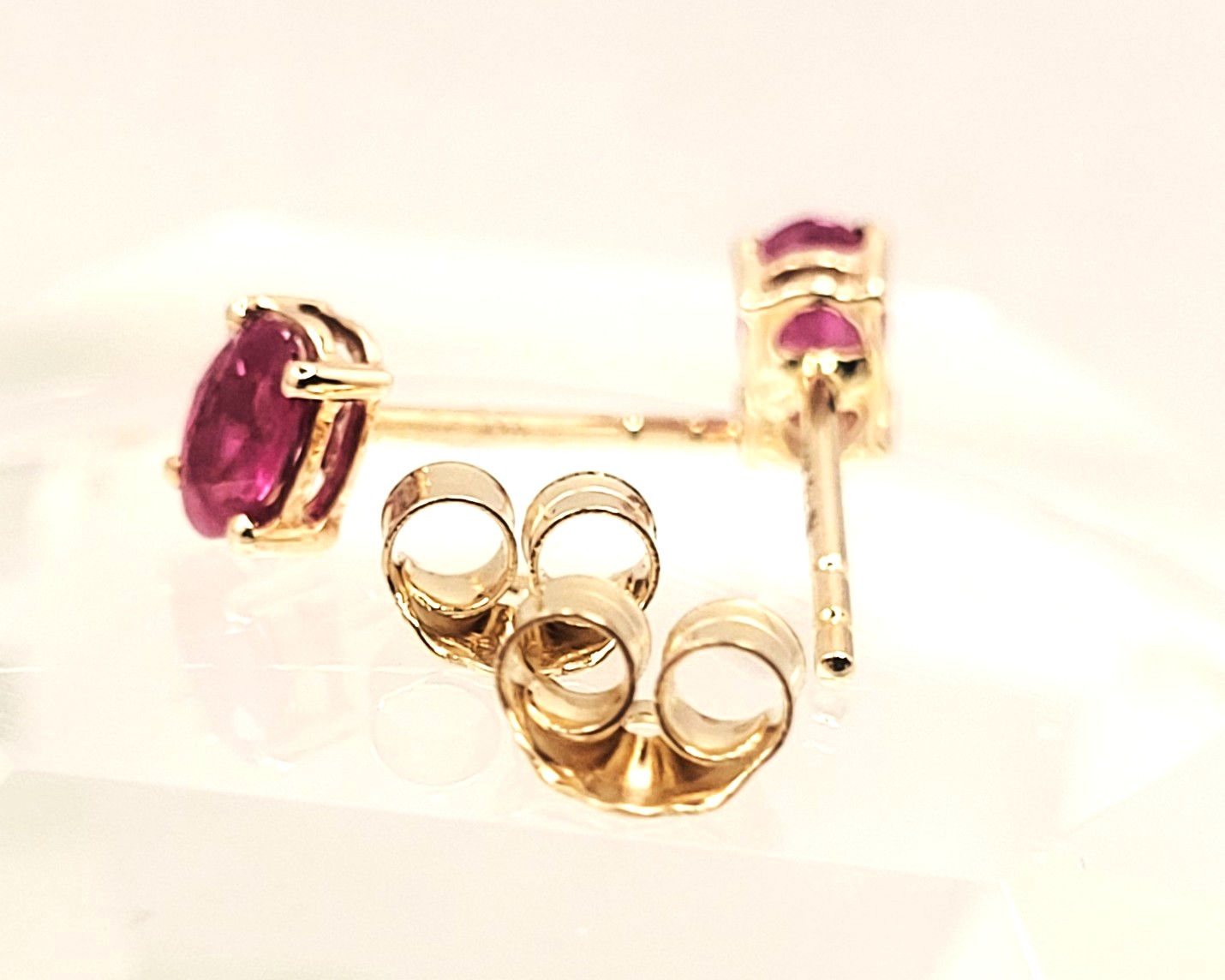 .75 CTW Genuine, Oval-Cut Ruby Solitaire Earrings 14K