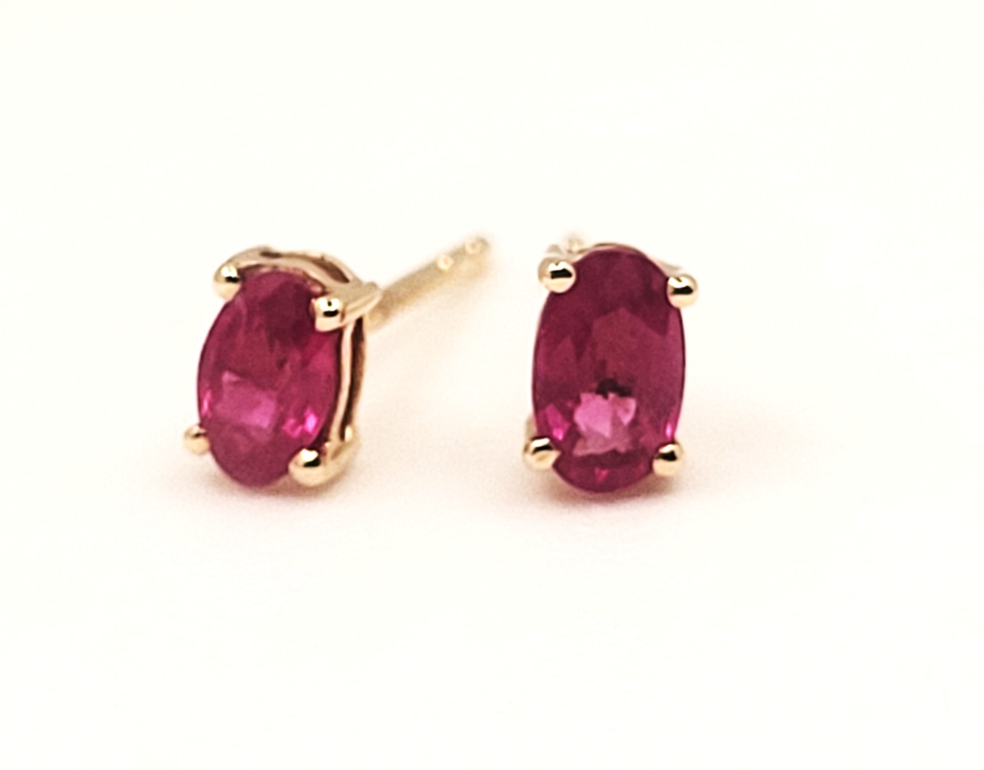 .75 CTW Genuine, Oval-Cut Ruby Solitaire Earrings 14K