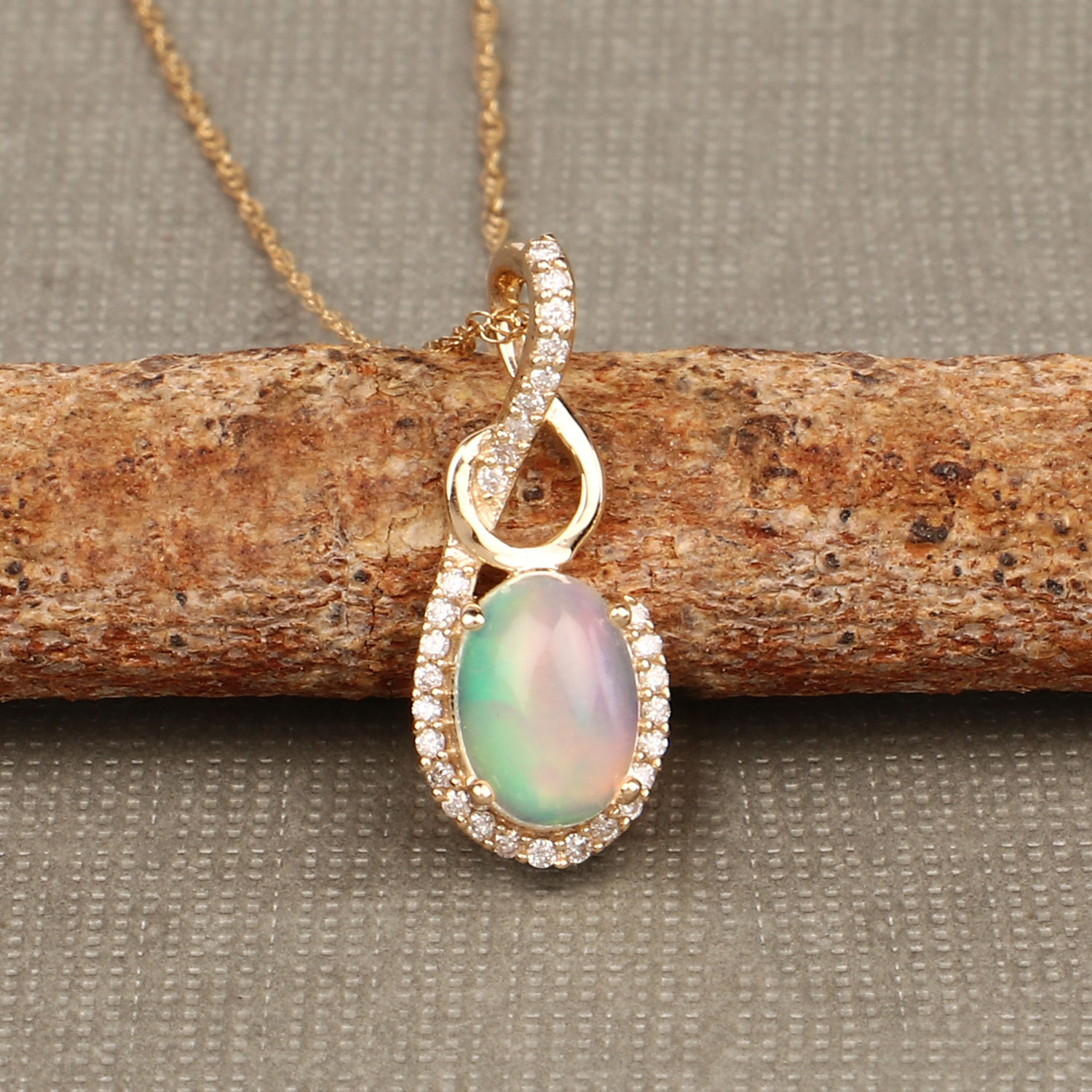 Ethiopian Opal and Swirled Diamond Pendant 14K