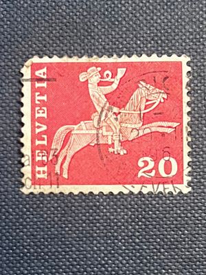 Used Switzerland 'Postrider' 20 Rappen Stamp, Mid-20th Century. A used Swiss postage stamp 